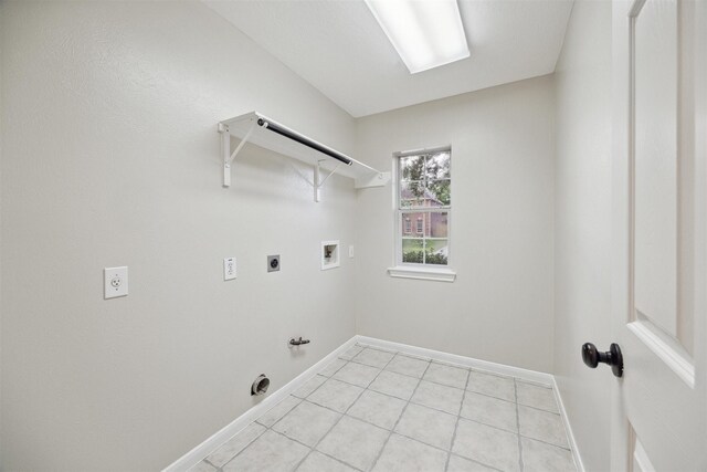 laundry room featuring washer hookup, electric dryer hookup, and light tile floors