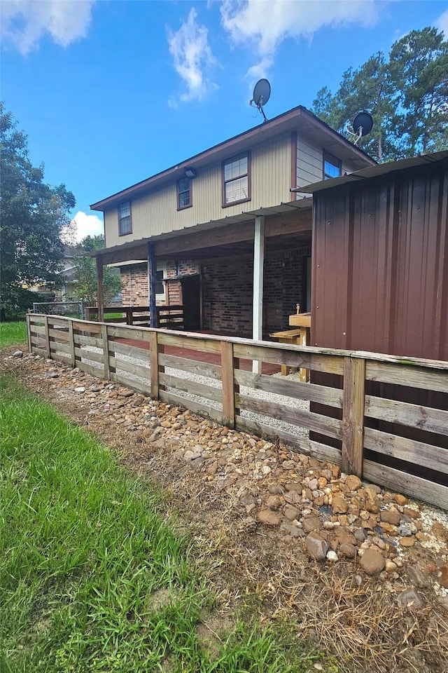 view of side of property featuring an outdoor structure