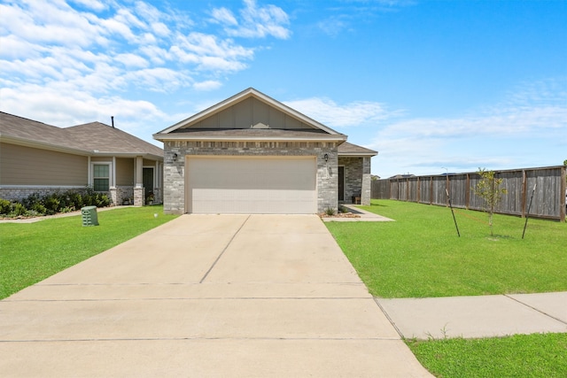 view of front of property featuring a garage and a front yard