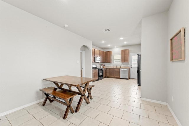 dining room featuring light tile patterned floors