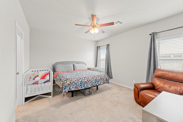 carpeted bedroom featuring ceiling fan