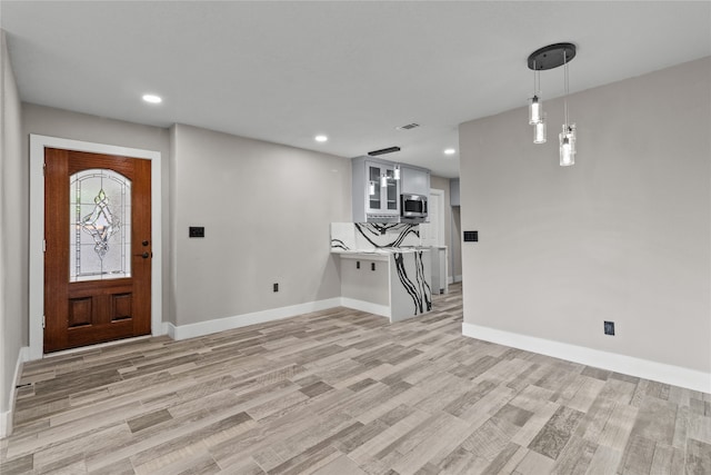 entrance foyer featuring light hardwood / wood-style floors