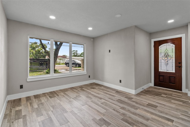 foyer entrance with light wood-type flooring