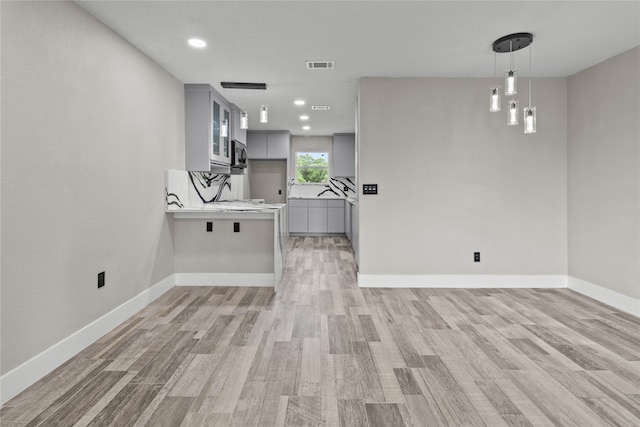 unfurnished living room with wood-type flooring