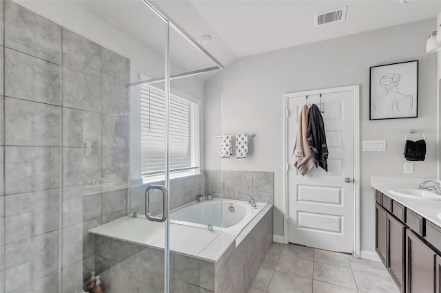 bathroom featuring tile patterned floors, vanity, and independent shower and bath