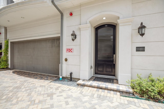 entrance to property featuring a garage