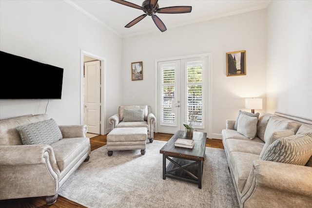 living room featuring ceiling fan, hardwood / wood-style flooring, ornamental molding, and french doors