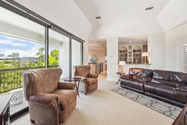 living room featuring vaulted ceiling and light carpet