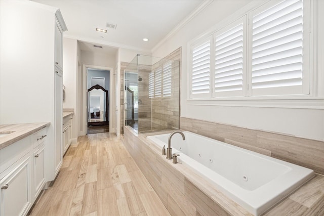 bathroom featuring separate shower and tub, vanity, crown molding, and hardwood / wood-style flooring