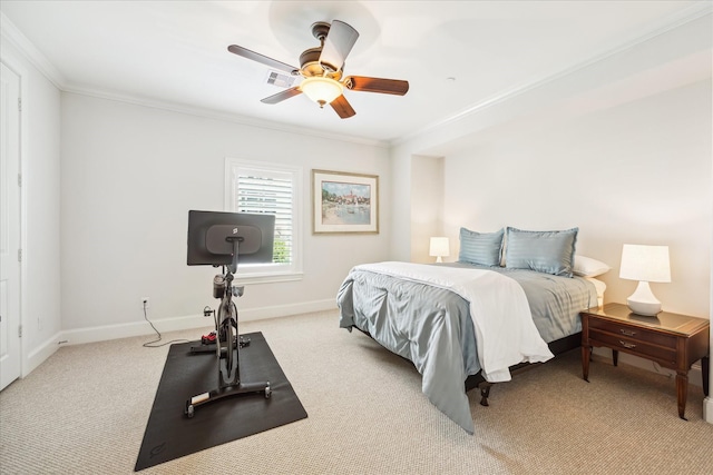 carpeted bedroom featuring ceiling fan and ornamental molding