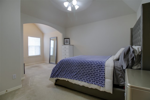 bedroom with carpet flooring, ceiling fan, and lofted ceiling