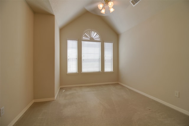 empty room with carpet flooring, ceiling fan, and lofted ceiling