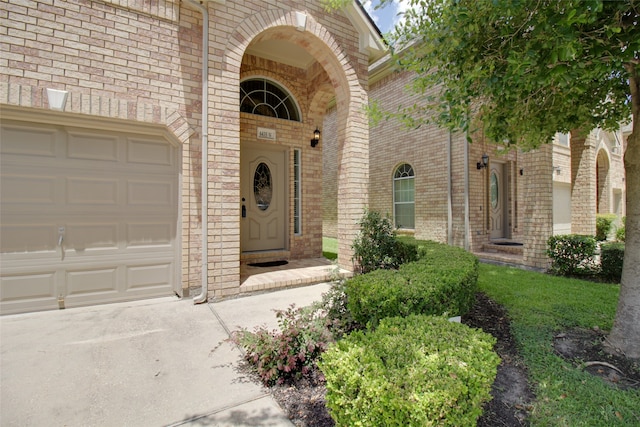 view of exterior entry featuring a garage