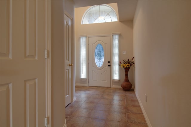 foyer entrance featuring tile floors and plenty of natural light