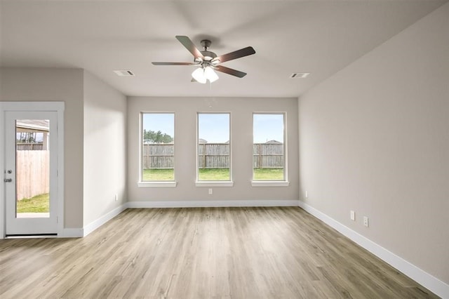 spare room featuring ceiling fan and light hardwood / wood-style floors