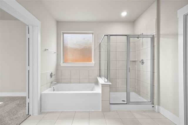 bathroom featuring separate shower and tub and tile patterned floors