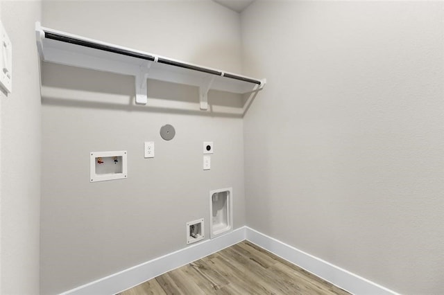 washroom with light wood finished floors, baseboards, hookup for a washing machine, electric dryer hookup, and laundry area