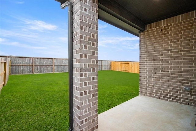 view of yard featuring a patio and a fenced backyard