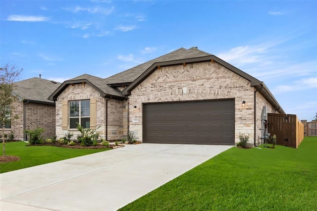 french country inspired facade featuring a front lawn and a garage