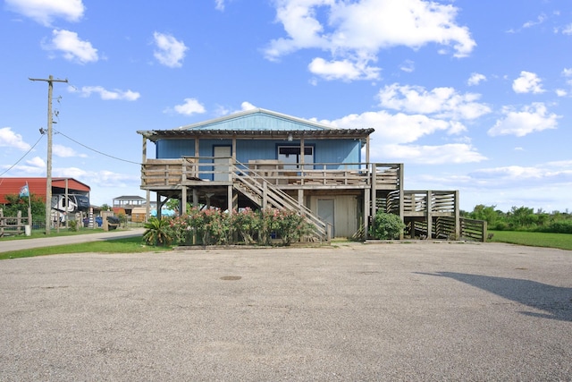 view of front of house with a deck