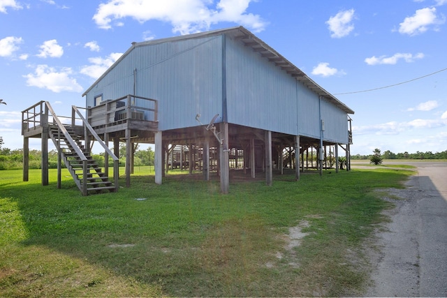 view of outdoor structure featuring a lawn