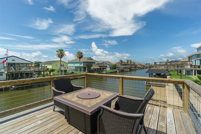 dock area featuring a deck with water view