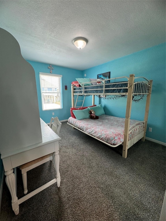 carpeted bedroom featuring a textured ceiling