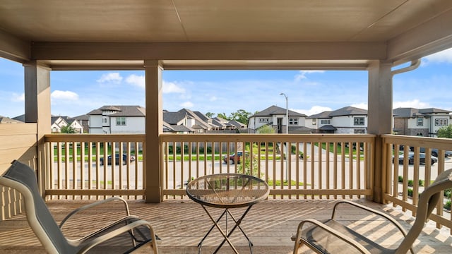 wooden terrace featuring a residential view