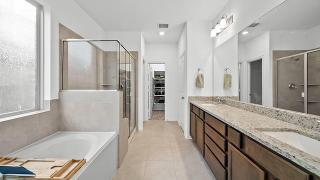 bathroom featuring separate shower and tub, tile patterned flooring, and vanity