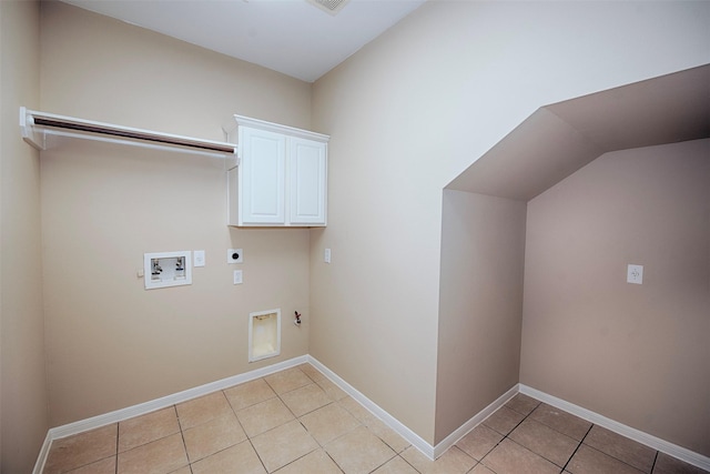 washroom featuring cabinets, washer hookup, electric dryer hookup, gas dryer hookup, and light tile patterned floors