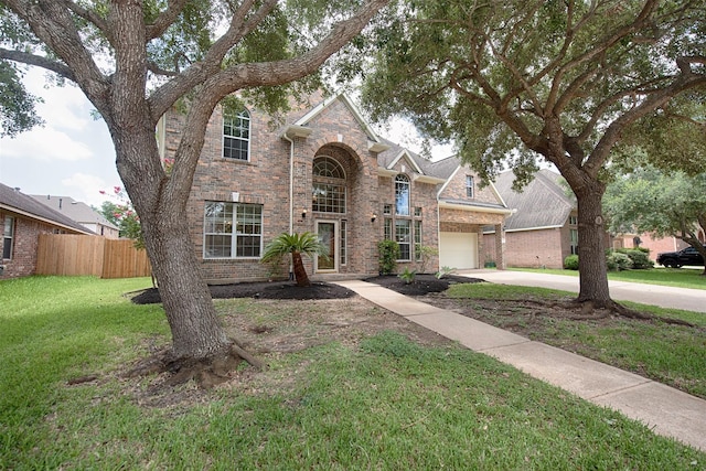 view of front of home featuring a garage and a front lawn