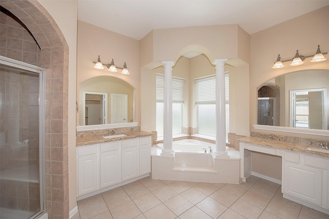 bathroom with tile patterned flooring, vanity, decorative columns, and plus walk in shower