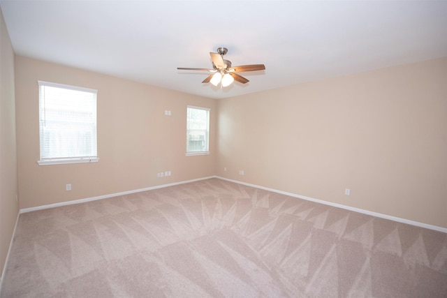 empty room with light carpet and ceiling fan