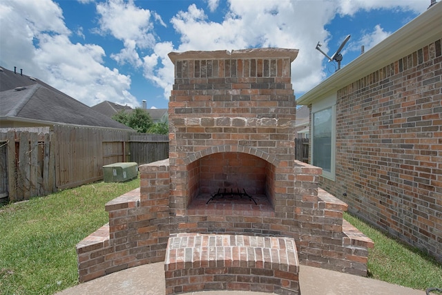 view of patio / terrace with an outdoor brick fireplace