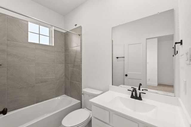 full bathroom featuring toilet, bathing tub / shower combination, and vanity