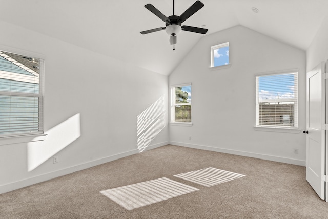 interior space featuring baseboards, a ceiling fan, and high vaulted ceiling