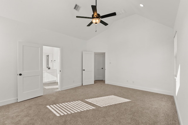 unfurnished bedroom featuring visible vents, baseboards, carpet, connected bathroom, and high vaulted ceiling