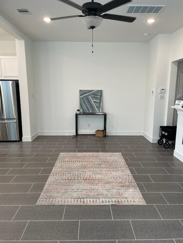 interior space featuring visible vents, baseboards, a ceiling fan, and recessed lighting
