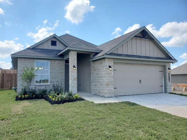 view of front of house featuring a front yard and a garage