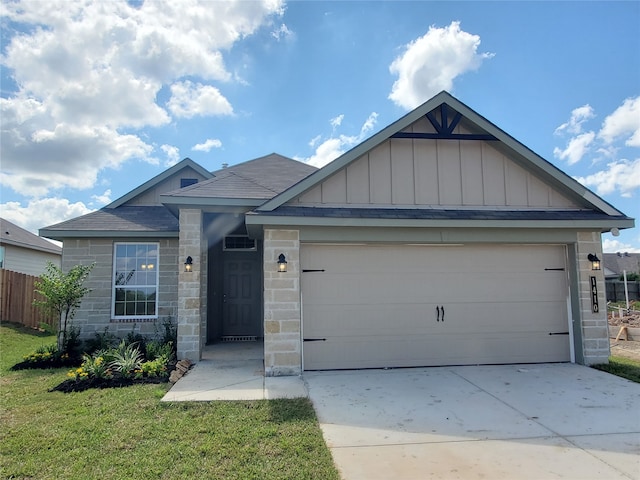 view of front facade with a front yard and a garage