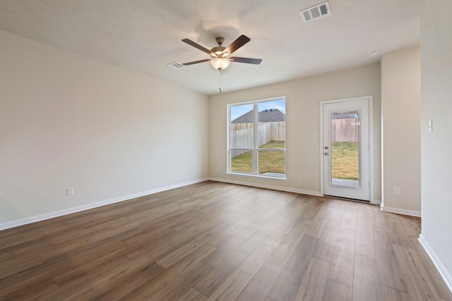 unfurnished room featuring ceiling fan and light hardwood / wood-style flooring