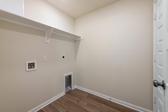 laundry area with electric dryer hookup, hookup for a washing machine, and dark hardwood / wood-style floors