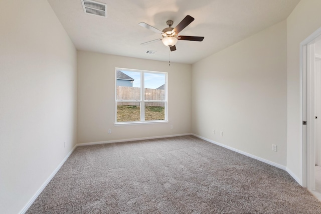 empty room featuring carpet and ceiling fan