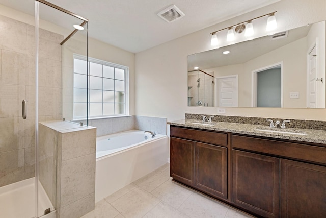 bathroom featuring vanity, tile patterned floors, and independent shower and bath