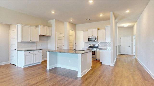 kitchen with white cabinetry, appliances with stainless steel finishes, and sink