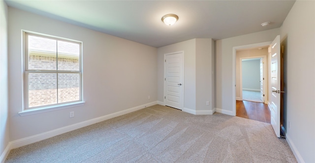 unfurnished bedroom with light carpet