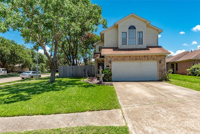 view of front property featuring a front yard and a garage