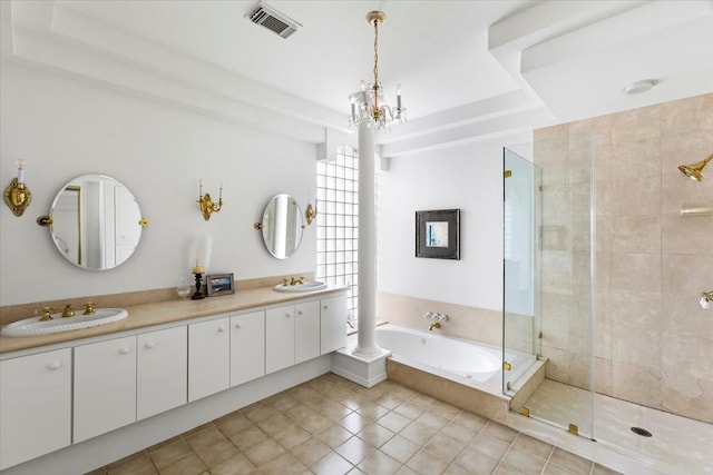 bathroom with tile patterned flooring, vanity, shower with separate bathtub, and a notable chandelier