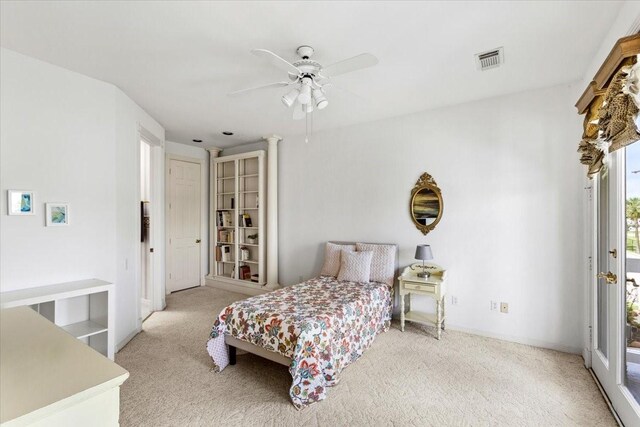 bedroom featuring ceiling fan, light colored carpet, and access to exterior