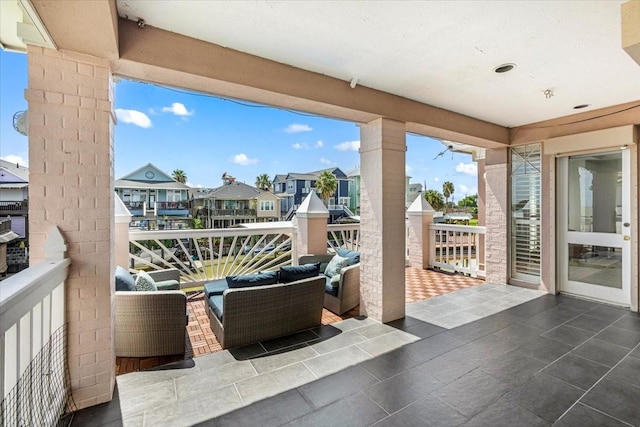 view of patio / terrace with a balcony and an outdoor hangout area